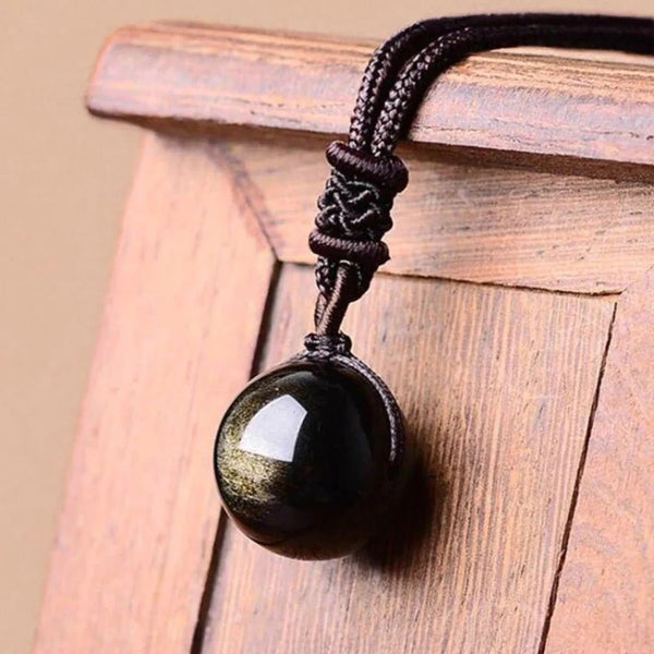 Pendentif : Gemme d'obsidienne dorée